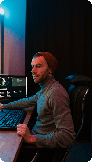 Male Video Editor Working on His Personal Computer with Big Display